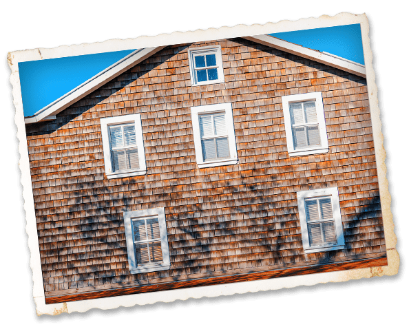 a house with three windows on the side of it